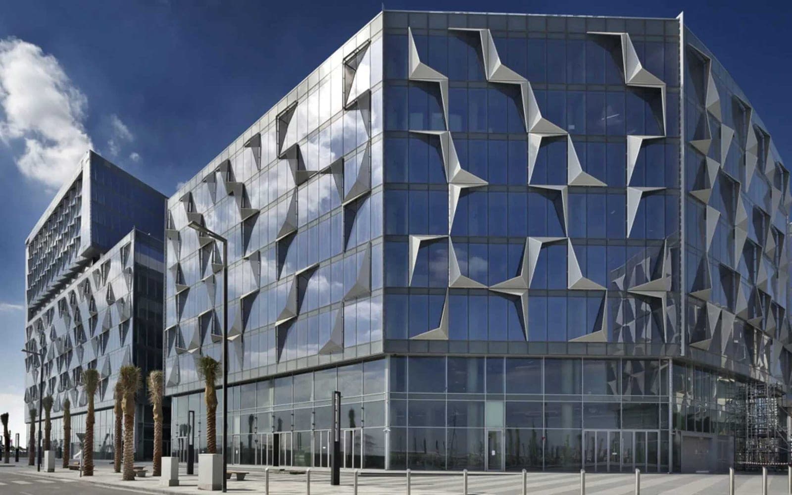 Glass office tower in Dubai Design District, a regular corporate chauffeur pickup point